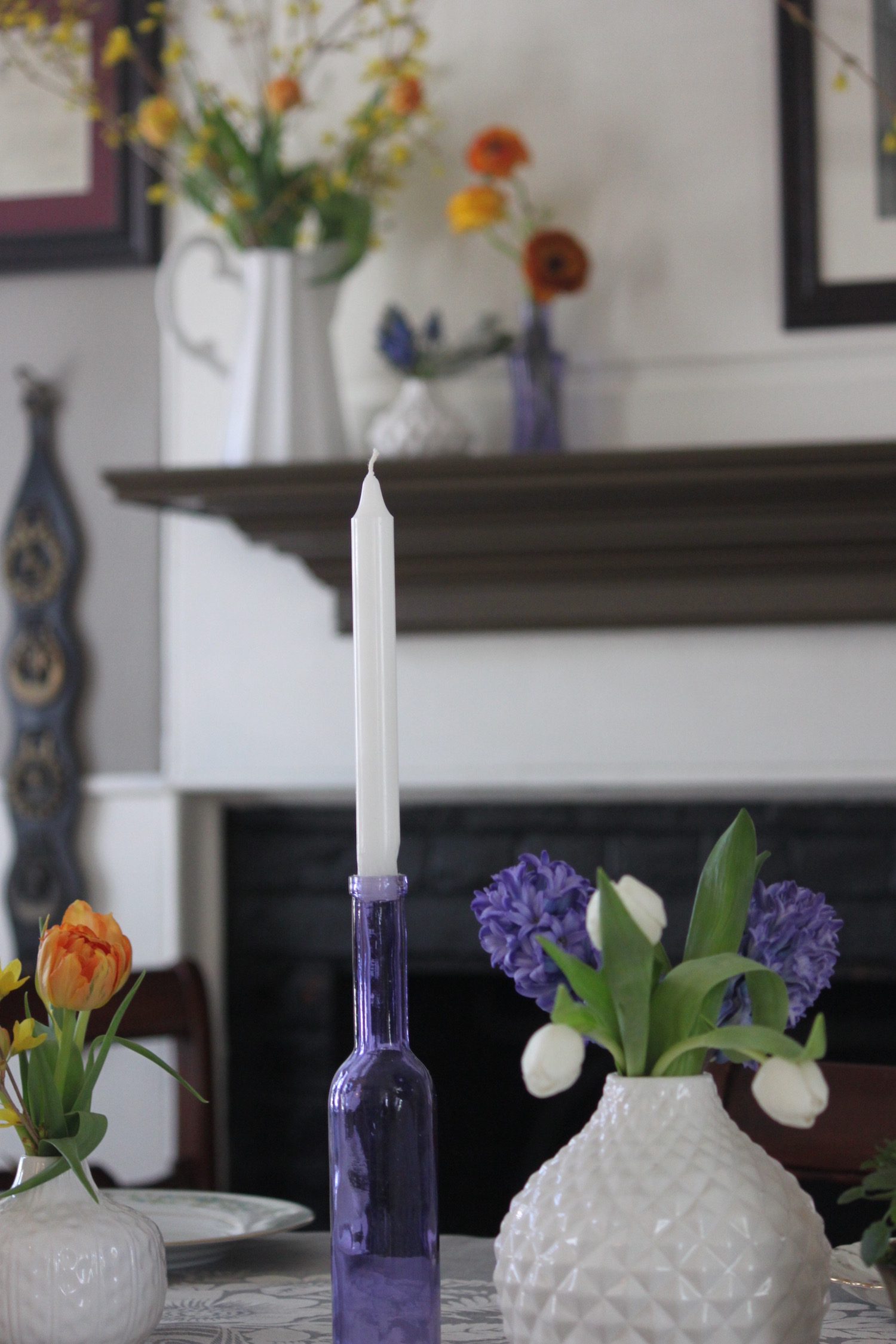 The once working fireplace and mantle is very wide so I used a milk jug vase from Two's Company.