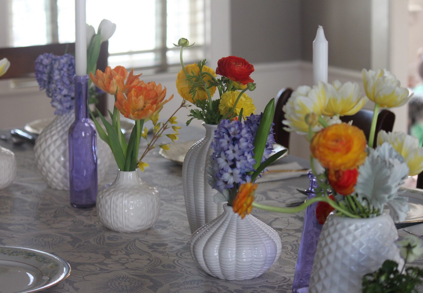 White vases in basket weave and geometric designs are a sleek and modern with a vintage feel.